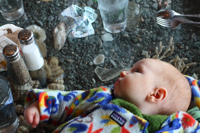 At the tidepool restaurant, the table provides a handy spot to put the baby