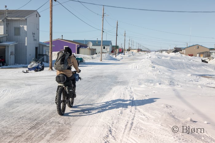 The village of Shaktoolik sits atop a berm on the eastern shore of Norton Sound. Kim rides down the only street of this beautiful and stark community.