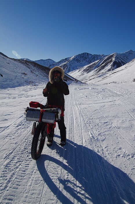 Kim nearing the summit of Rainy Pass on the Iditarod Trail. The proposed natural gas pipeline to supply <a href=http://www.alaskadispatch.com/article/donlin-mine-moves-slowly-toward-reality>power to the mine</a> would pass through this corridor.
