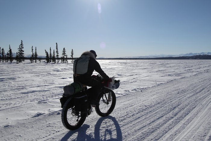 Biking toward the Alaska Range. This is one of the places where the proposed natural gas pipeline, to supply power to the mine, would cross the historic Iditarod Trail.