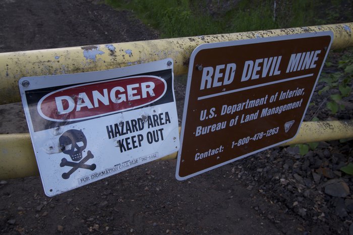 The Red Devil mine. This historic cinnabar mine has become an environmental nightmare for the BLM. Efforts to remediate the mine are underway,  <a href=http://www.groundtruthtrekking.org/Issues/OtherIssues/TrueCost.html>at the expense of taxpayers.</a> 