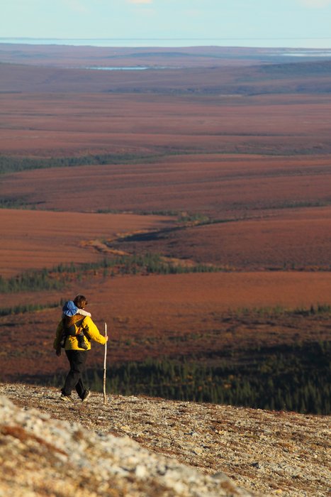 Erin strides on a dry tundra ridge.