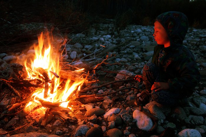 Katmai enjoys an evening fire.