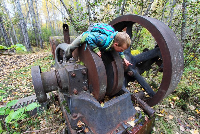 Katmai explores an old abandoned steam engine near the abandoned Buffalo Mine.
