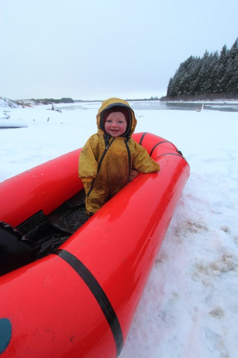 Hanging out in the packraft-crib, Lituya was very cheery despite the cold sleety day.