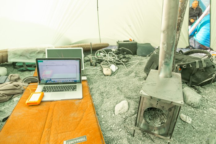Expensive, and often state of the art, technology was employed to document, map, and study the landslide generated tsunami, in Taan Fjord, Alaska, which occurred in October 2015. Three successful expeditions were undertaken,  in the summer of 2016, to study the event. This battery charging shelter was warmed with a small, light-weight, titanium wood stove.  