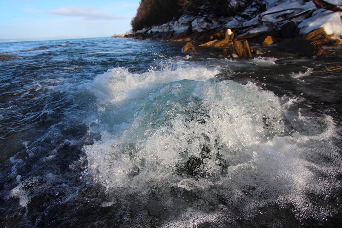 Water boils up from beneath an ice dam into the ocean at the outlet of Barabara Creek