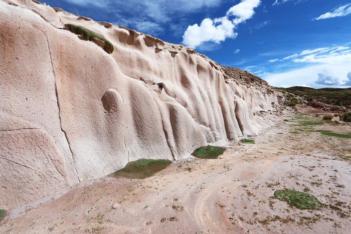 Along the banks of the Deseguadero river, this white layer rock is a record of an ancient and violent volcanic eruption.