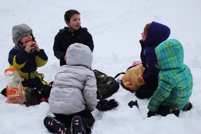Seldovia's future Ground Truth Trekkers enjoy lunch on a frozen lake