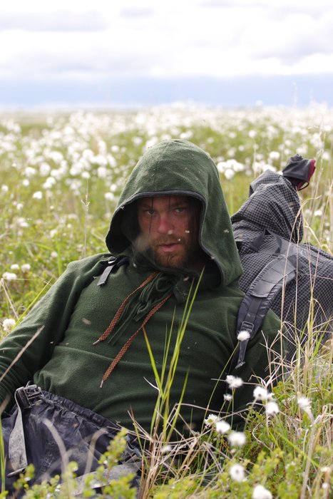 Tom exhausted in a marsh of cotton grass, along the lower Kvichak River.
