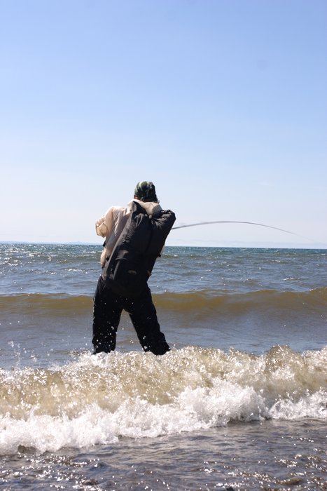 Tom fishing in the surf on Lake Iliamna.