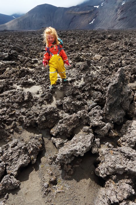 Angular lava, partially draped in volcanic ash, cover part of the floor of Okmok Caldera.