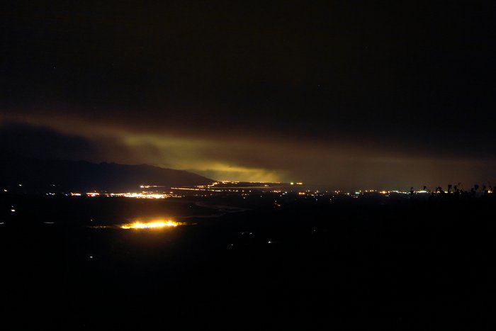 Anchorage, Palmer, and the Palmer Correctional Facility light low clouds, as seen from Wishbone Hill.