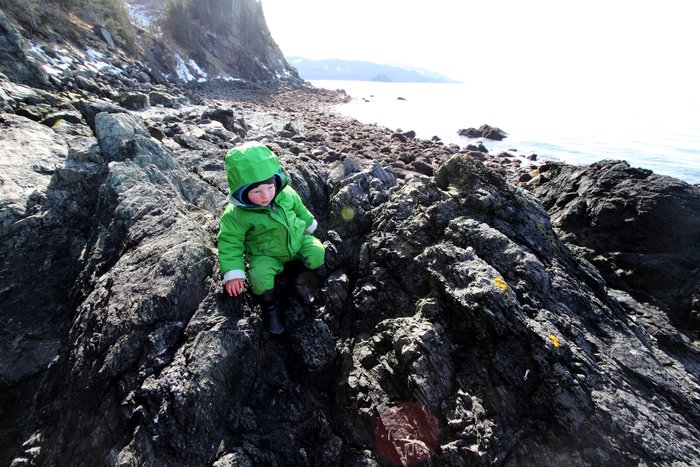 Lituya climbs over a rocky point.