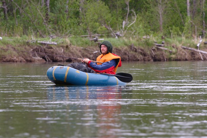 Tom fishing from the Alpacka raft on the Mulchatna River. 