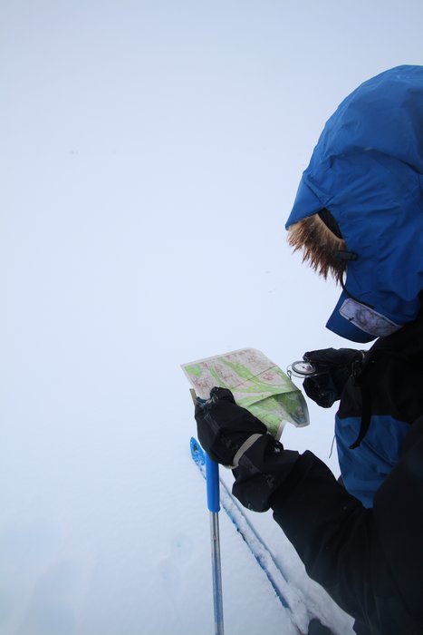 The compass is often reserved for whiteouts, but USGS topo maps, printed out on waterproof paper, are our main aid to navigation