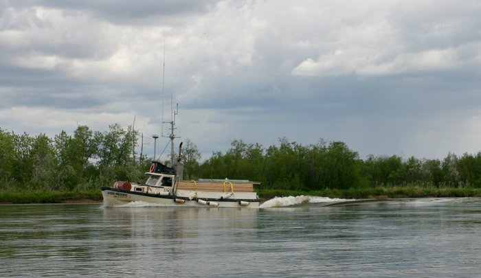 Boat steaming up the Nushagak River. 