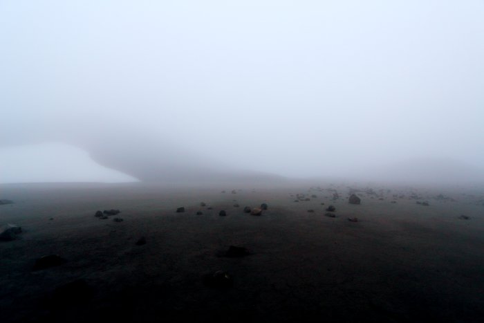 In the fog, exploring the crater of Pakushin Volcano.
