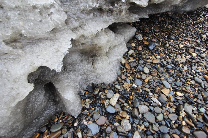 I shot this photo when the waves retreated, before they smacked again into exposed permafrost.