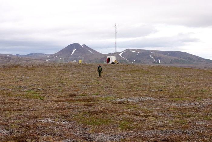 Approaching a weather station on the hill, tailings lake area. 