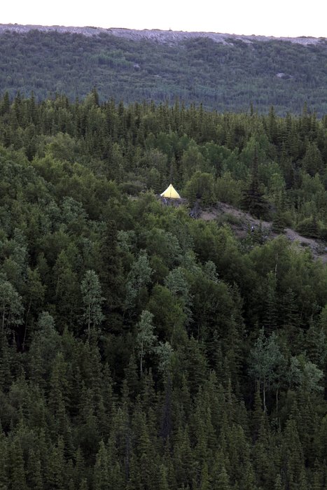 I took a walk after camping.  Our yellow and gray pyramid tent really stuck out in the dim dusk light.