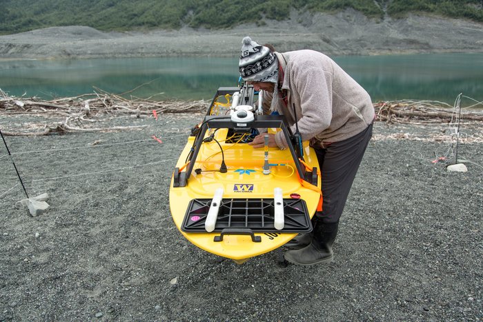 Dr. Jeremy Venditti installs components into a unique, marine surveying, remote control boat. This RC boat was used to map the shallow sea bed of Taan Fjord. 