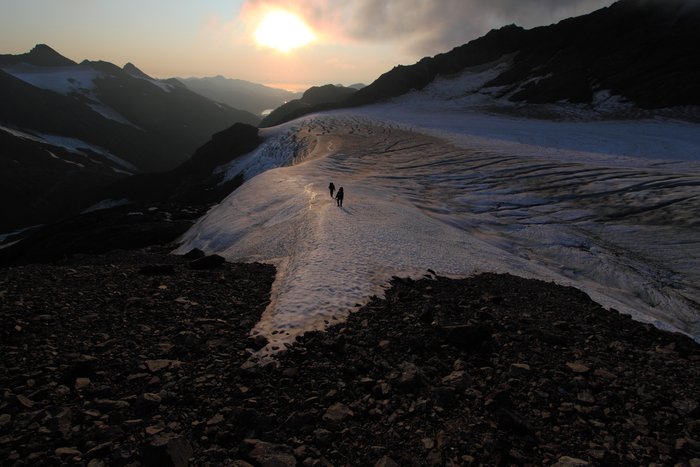 This flat patch in a glacier provides safe passage walking on flat ice between arcing crevasses.