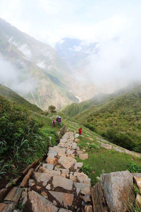 At Choquequirao, these steep steps lead down to an isolated patch of terraces atop a cliff.