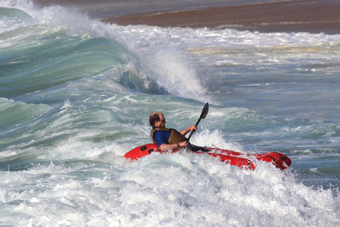 Packrafts surf fine, but after a wave breaks over your head, you might be dealing with a lot of water in the boat.