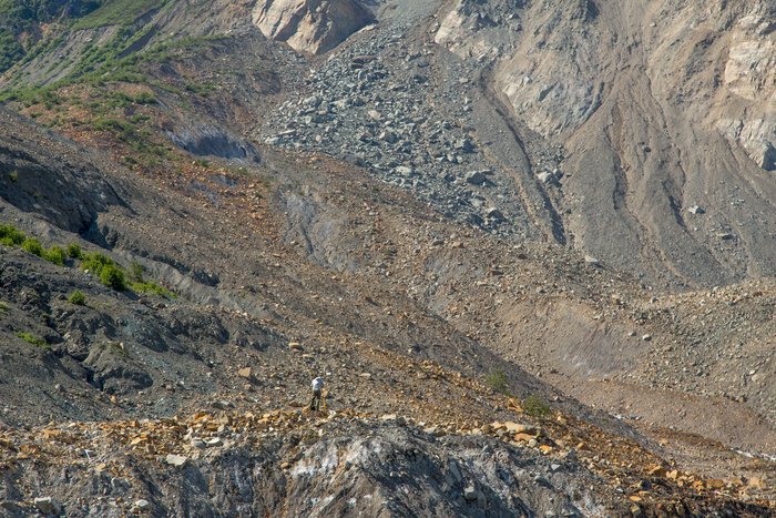 Vasillios Skanavis surveys in front of the landslide, in Taan Fjord, Alaska. 