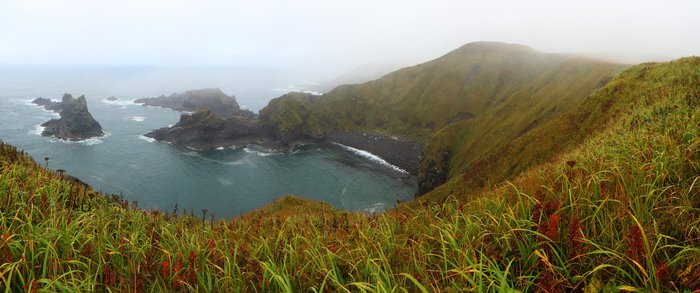 This pocket in a lava coastline below Makushin Volcano in the Aleutians provides a relatively easy spot to launch or land a packraft.