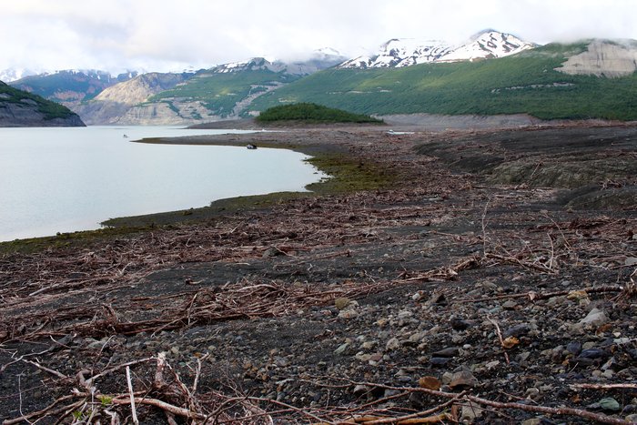 About halfway down the fjord, 10 kilometers from the tsunami source, the tsunami was still stripping the land bare.