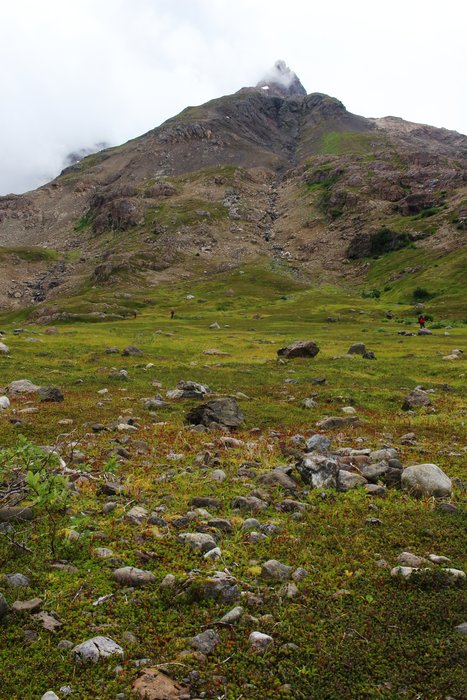 The boulder-littered tundra meadows here high in Tutka Valley provide ample camping even for a large group.