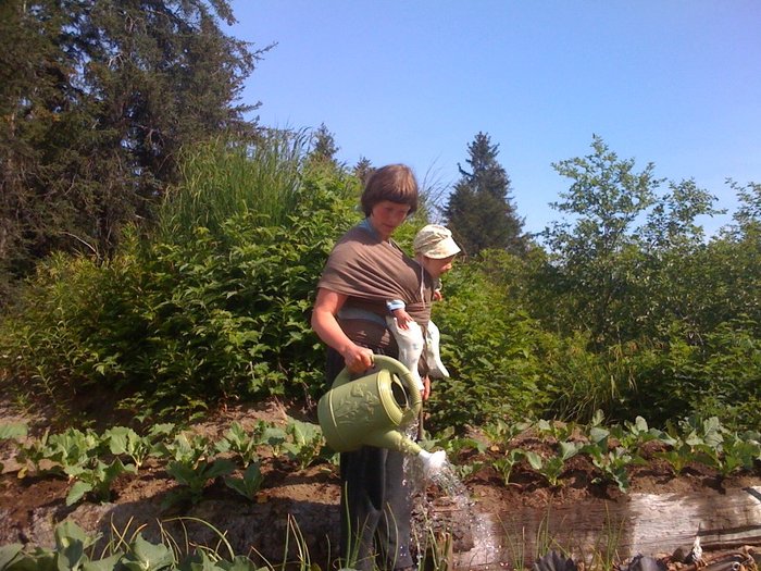 Little Katmai and mom watering the garden (summer 2009).