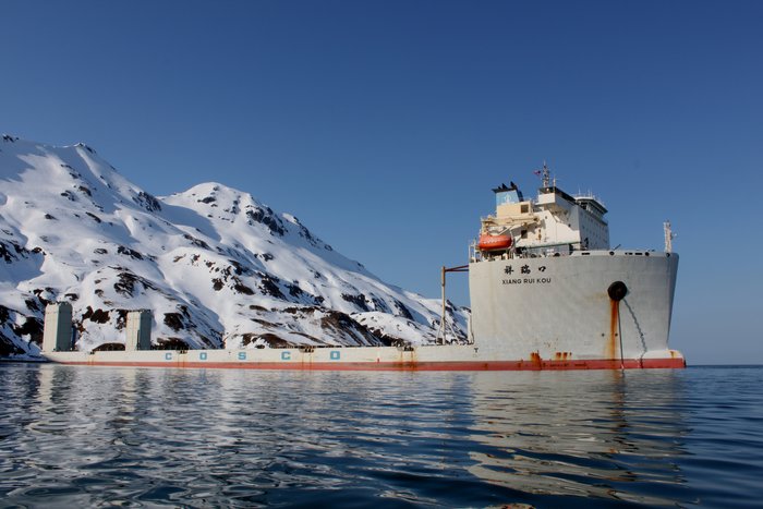 This unusual ship is designed to carry oil rigs, and will partially submerge for a rig to be loaded on board.  Here it's parked in Dutch Harbor, preparing to take on Shell's damaged Kulluk drill rig.