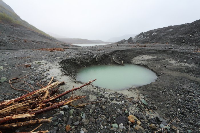 This kettle formed in just half a year after stranded glacial ice was shallowly buried by tsunami sediment.